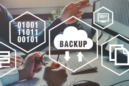 Backup and recovery icons for computer overlaid on people working on computers