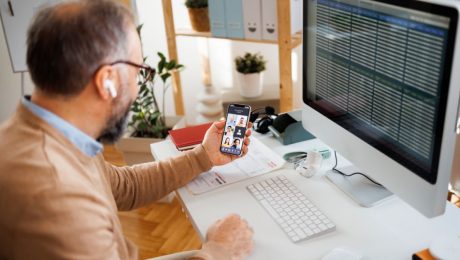 Remote worker on phone meeting and on computer