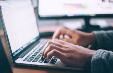 man working on open laptop